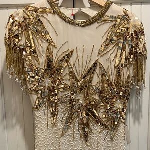 Vintage Niteline beaded dresses still has Tags.